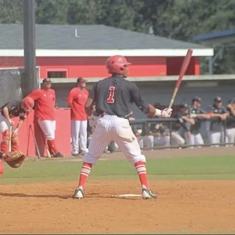 Quade Smith at the plate wearing #1